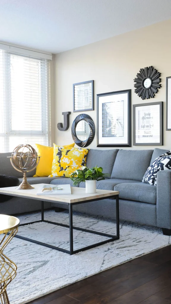 Modern living room with a grey sofa, bright yellow accent pillows, and a black and white gallery wall for chic home decor ideas.
