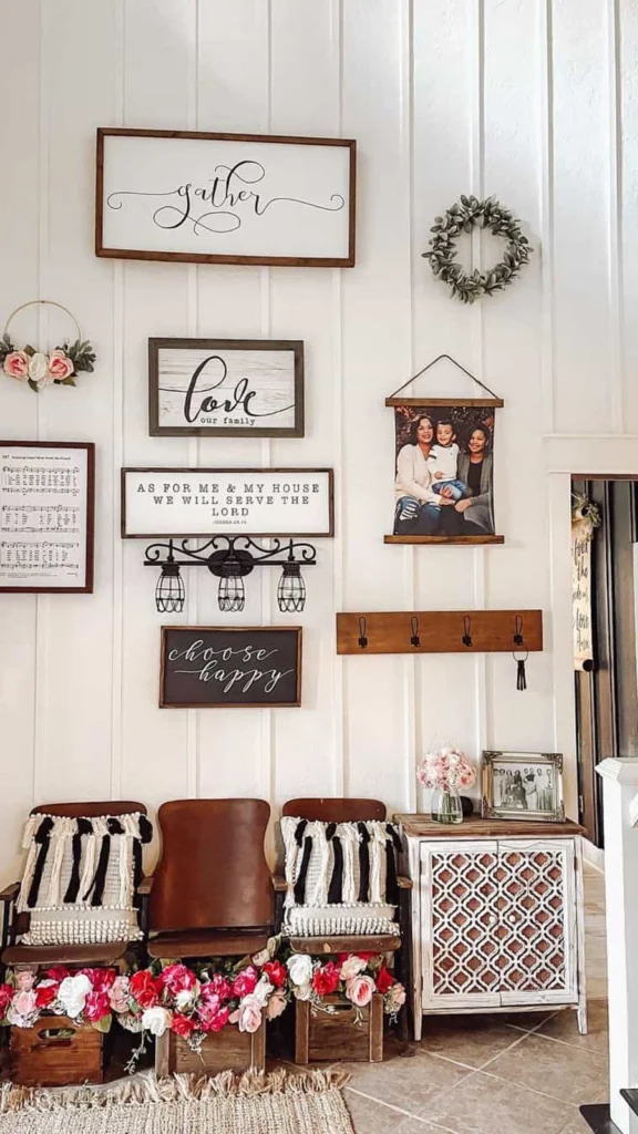 High-ceiling foyer displaying wall decor ideas with vertical board and batten walls, wood-framed quote signs, and vintage cinema seats.