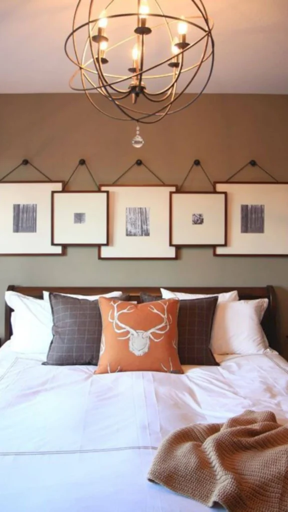 Master bedroom showing wall decor ideas with five square framed art prints hanging in a row with leather straps above a dark wood bed.