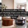 A Pinterest pin collage showing four living room interiors centered around round coffee tables with a black text banner reading 'Round Coffee Table: 20 Styling Tips and Design Ideas for Every Living Room in 2026'. Visuals display nested white round tables, a fluted wood drum coffee table, a classic dark turned-leg table, and a chunky solid wood coffee table by a light neutral sofa.