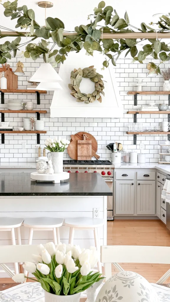 Bright white kitchen showing kitchen decorating ideas with open wooden shelves